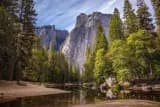 Pine forest and granite cliffs by a river, waiting in the queue